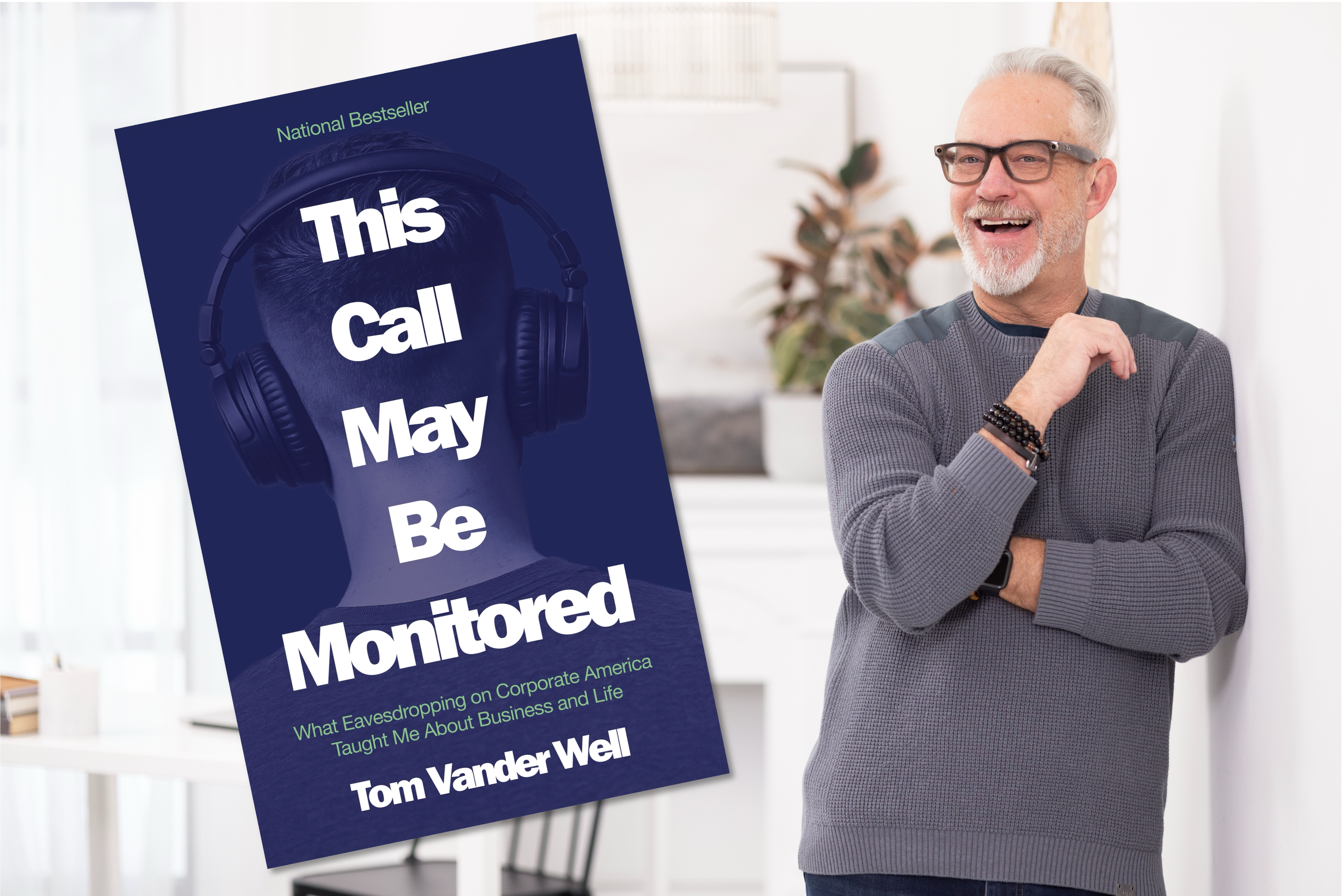 A smiling man in a gray sweater is standing next to the book cover of 'This Call May Be Monitored' by Tom Vander Well, which features a design of a head with headphones.